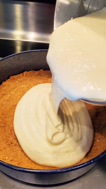 Pouring Cheesecake Filling into Crust