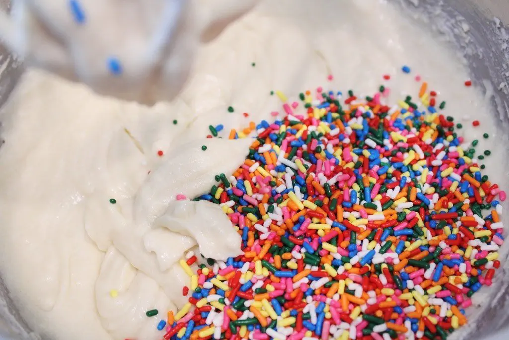 Adding Jimmies Sprinkles to the Muffin Batter