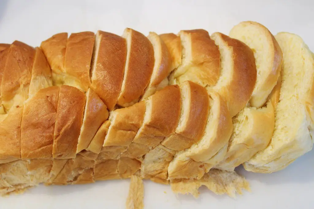 Slicing a Brioche Loaf of Bread