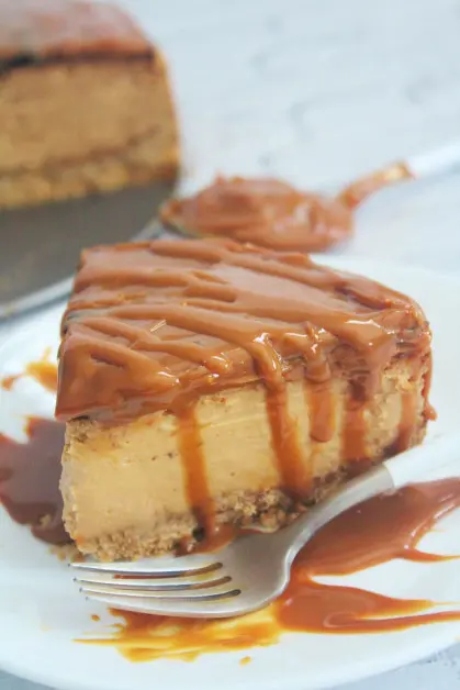 Serving a Slice of Dulce de Leche Cheesecake made in the Air Fryer