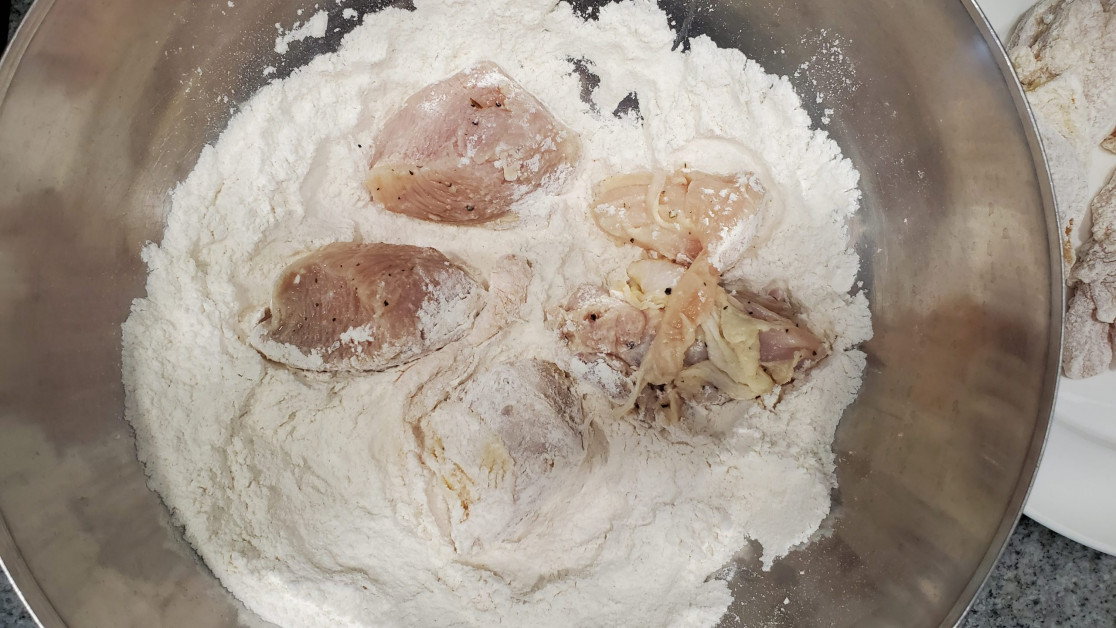 How to coat each piece of chicken in flour before air fryer.