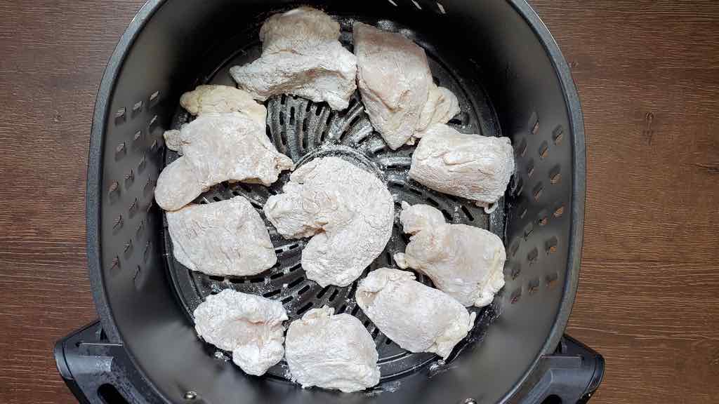 This is how you place each piece of chicken inside the air fryer to cook.