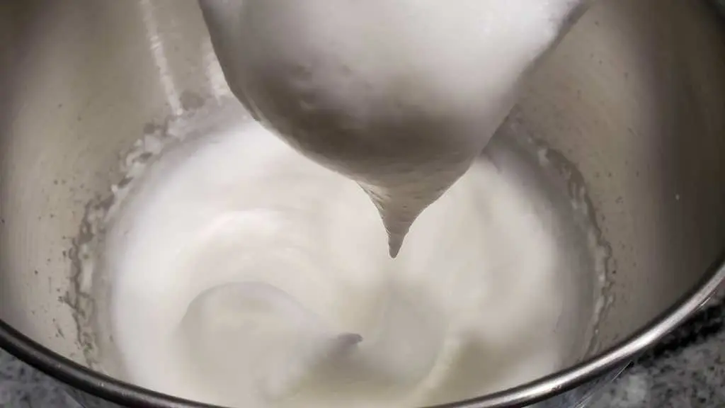 Beat the egg whites on high speed until stiff peaks like this one form.