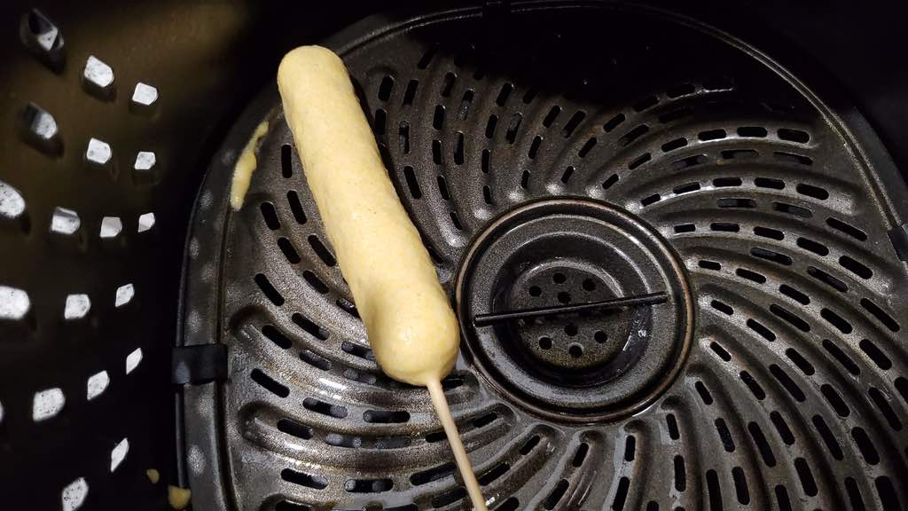 This is how you place the corn dog inside of the air fryer to make them.