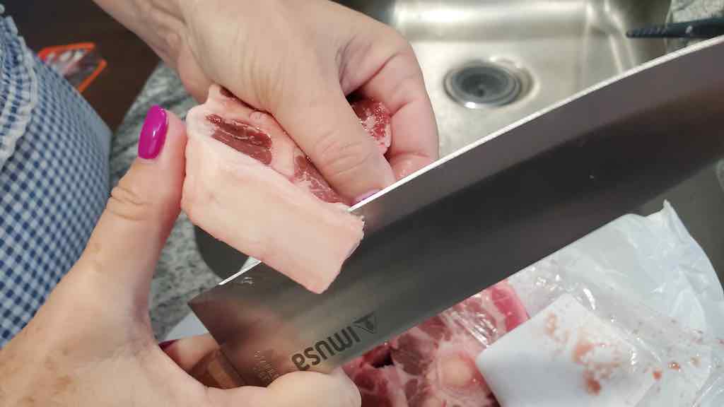 This is how you cut the fat off of each oxtail before pressure cooking.