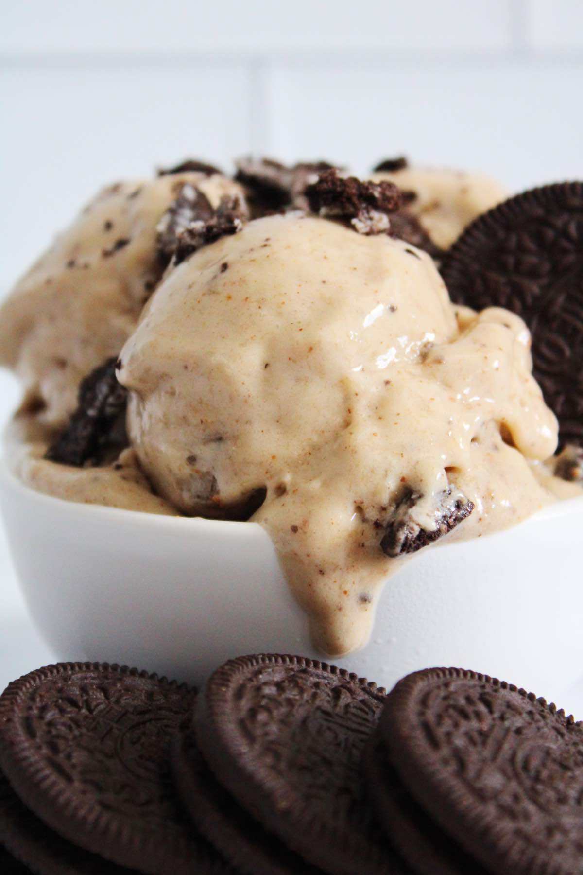 The ingredients you'll need to make cookies and cream nice cream are bananas, vanilla almond butter and oreo cookies.