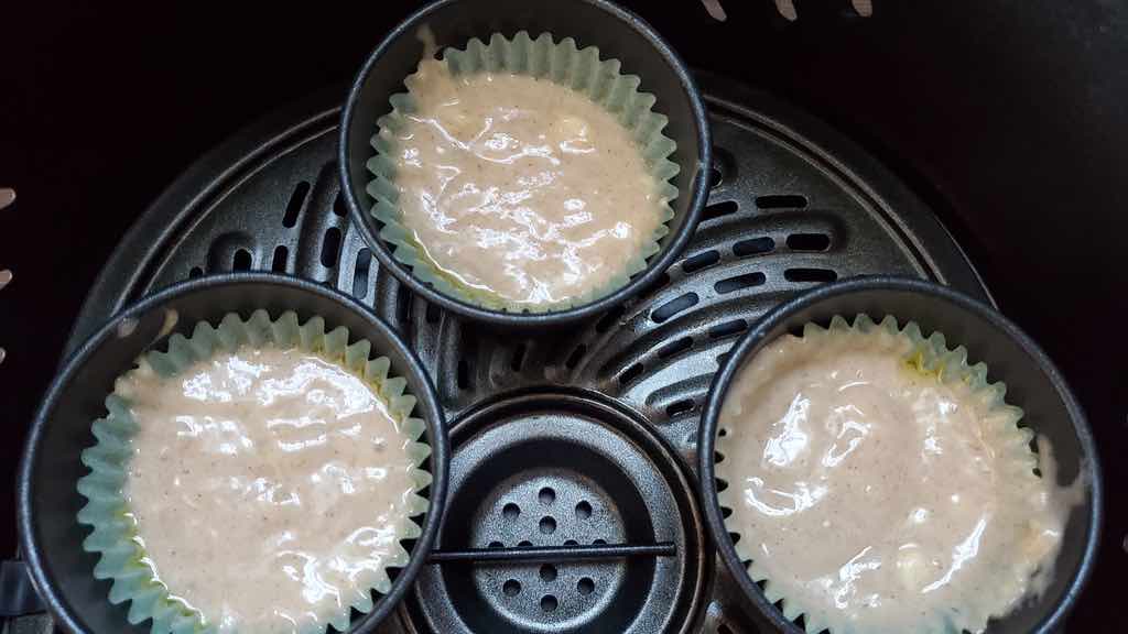 Pour the muffin batter into the cupcake liners and air fry them in the muffin pan.