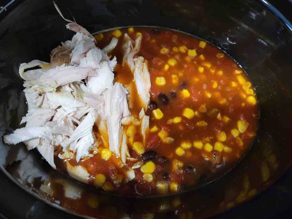Add the leftover turkey to the soup at the last 30 minutes of cooking as shown in this photo.
