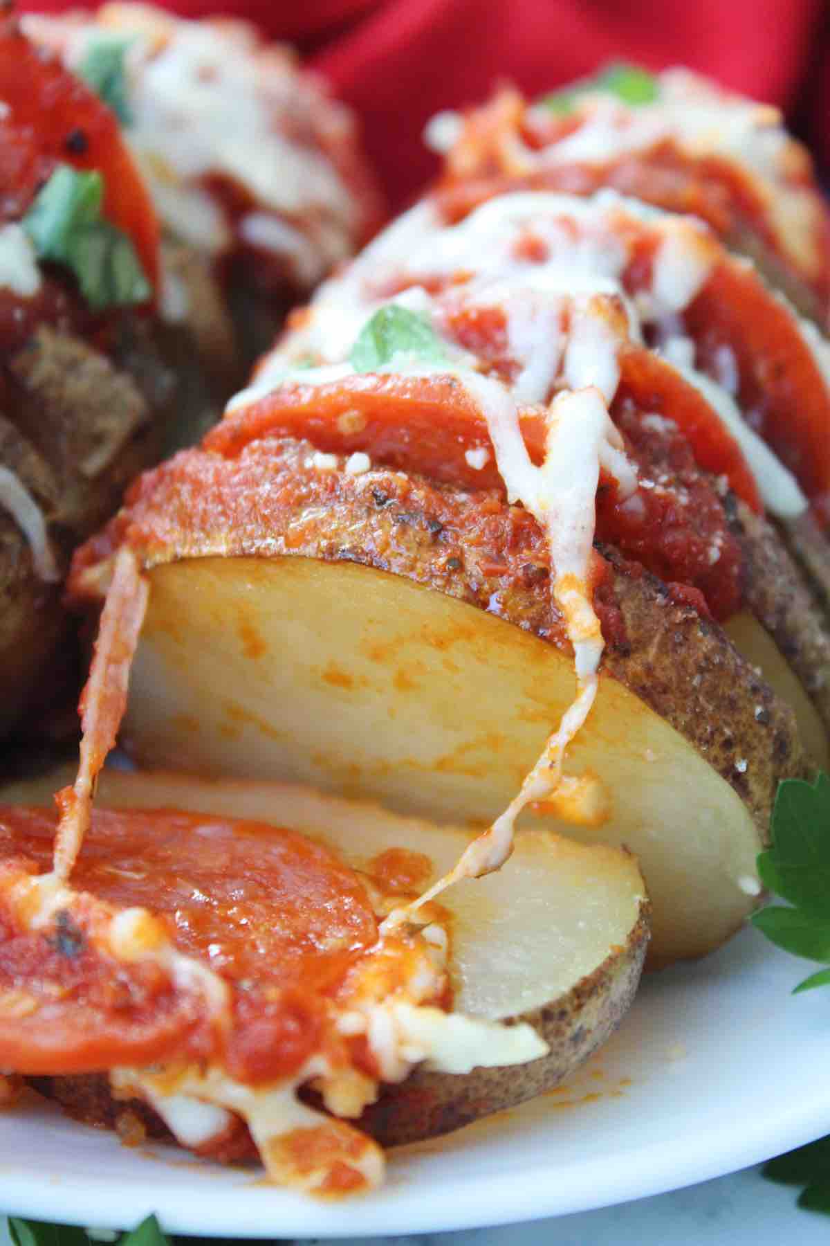 Baked potato with pizza toppings.