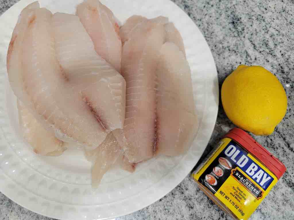 The ingredients needed for this recipe are tilapia fillets, lemon juice and blackened seasoning.