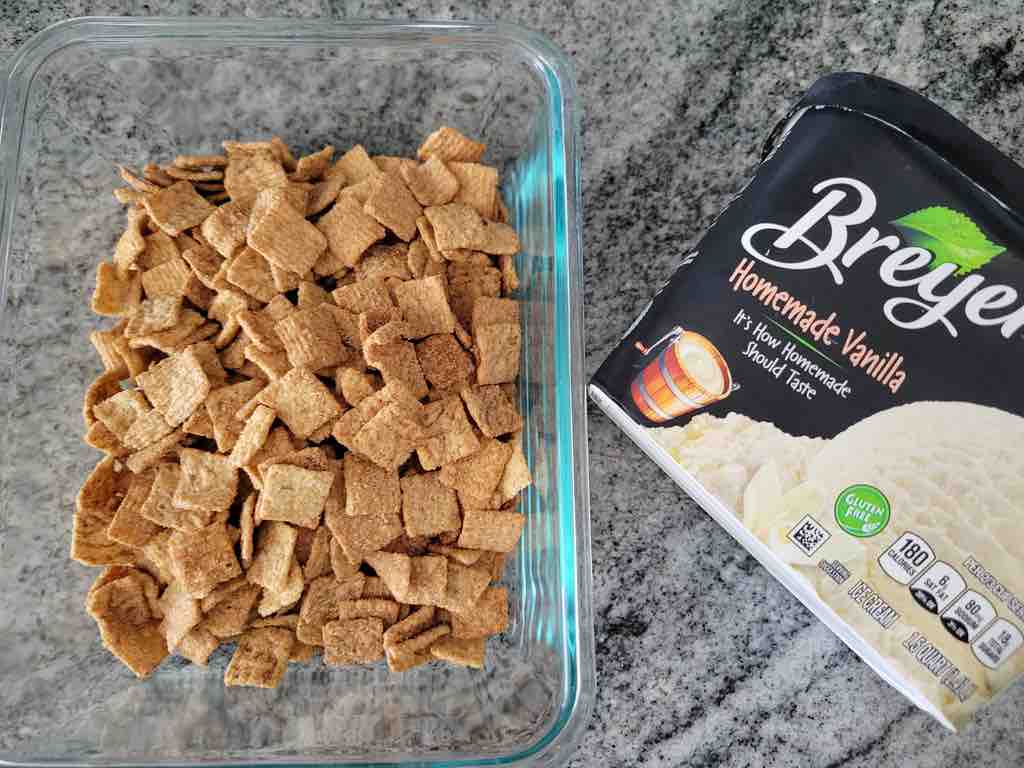 The ingredients needed for this recipe are vanilla ice cream and Cinnamon Toast Crunch cereal.