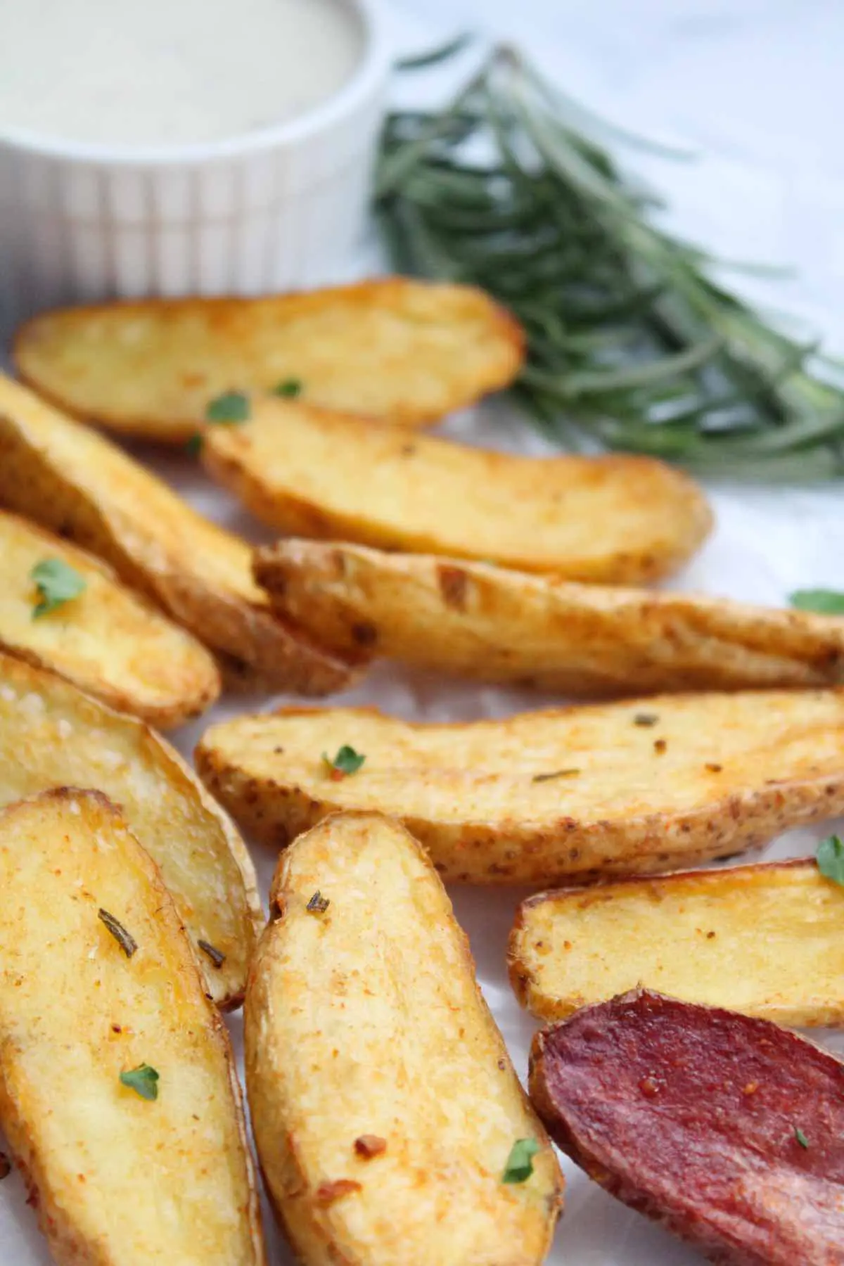 Roasted air fryer fingerling potatoes are made with garlic and fresh herbs.