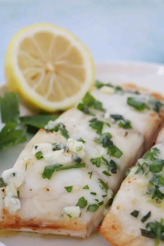 Red snapper is topped with garlic butter straight out of the air fryer.