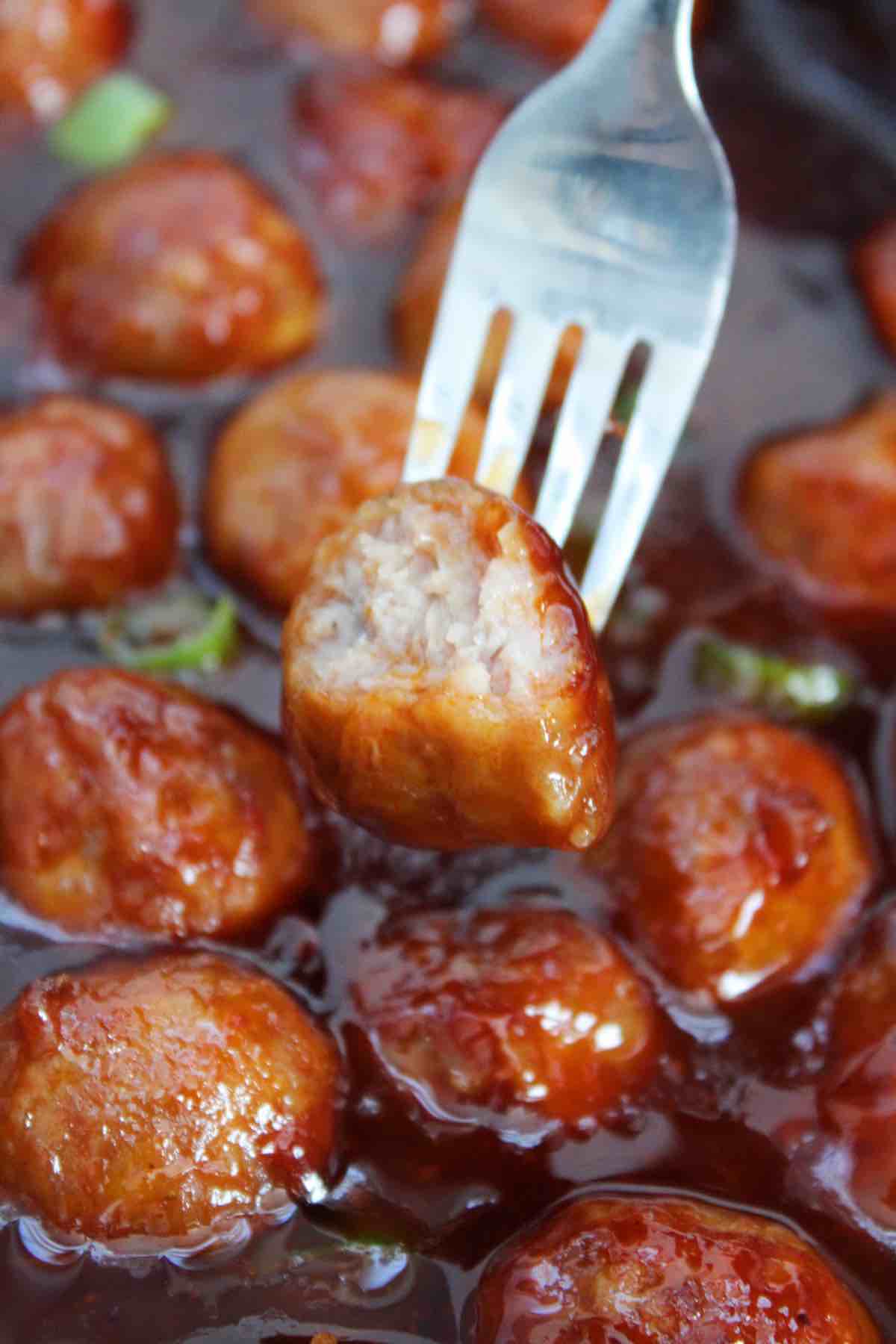 Candied, beer braised kielbasa is topped with green scallions then served as shown in the photo.