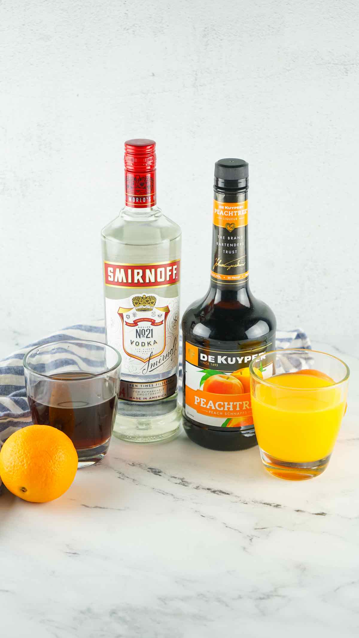 The ingredients needed to make this drink are vodka, peach schnapps, orange juice and cranberry juice.