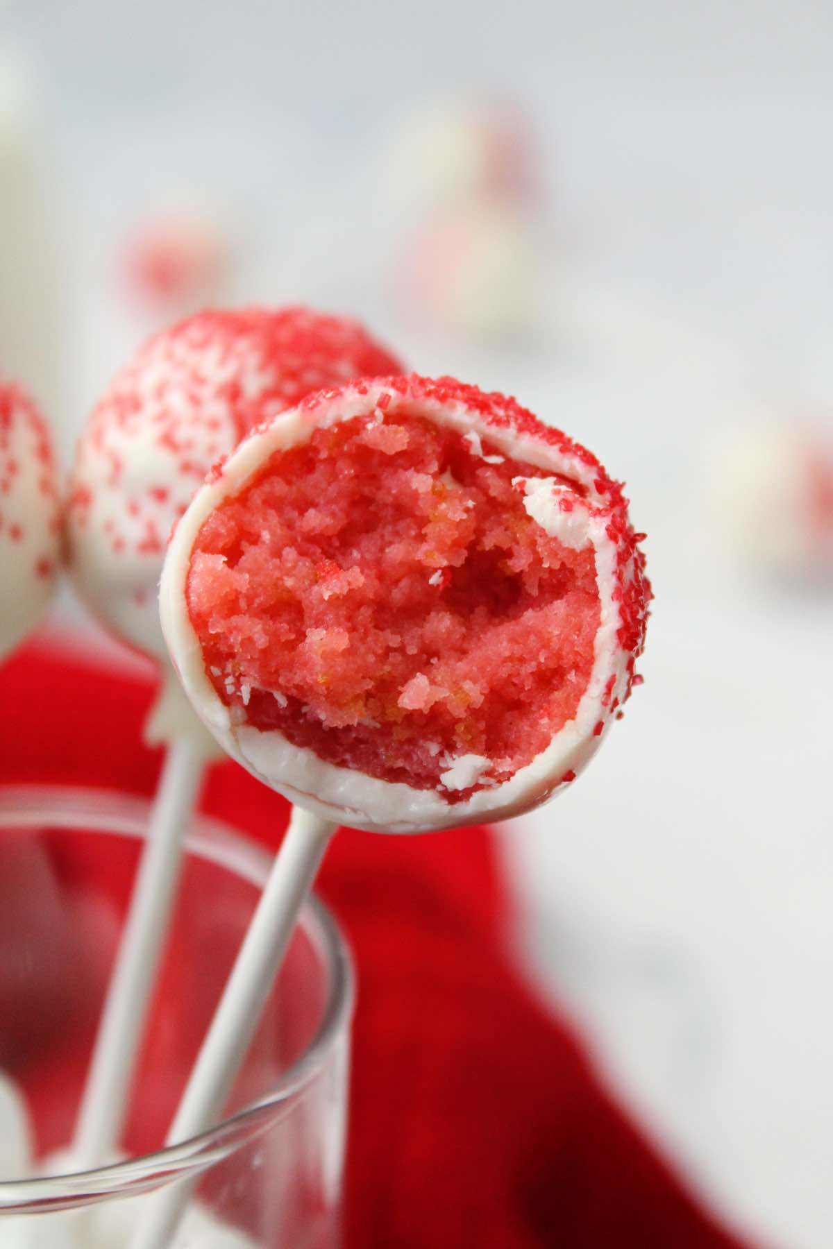 These strawberry cake balls taste like cheesecake because of the cream cheese frosting on the inside.
