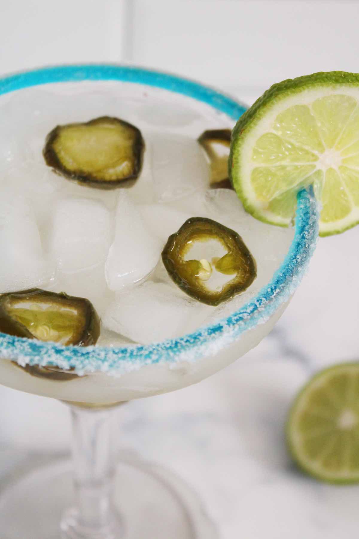 Enjoy a homemade spicy jalapeno margarita cocktail on your next happy hours.