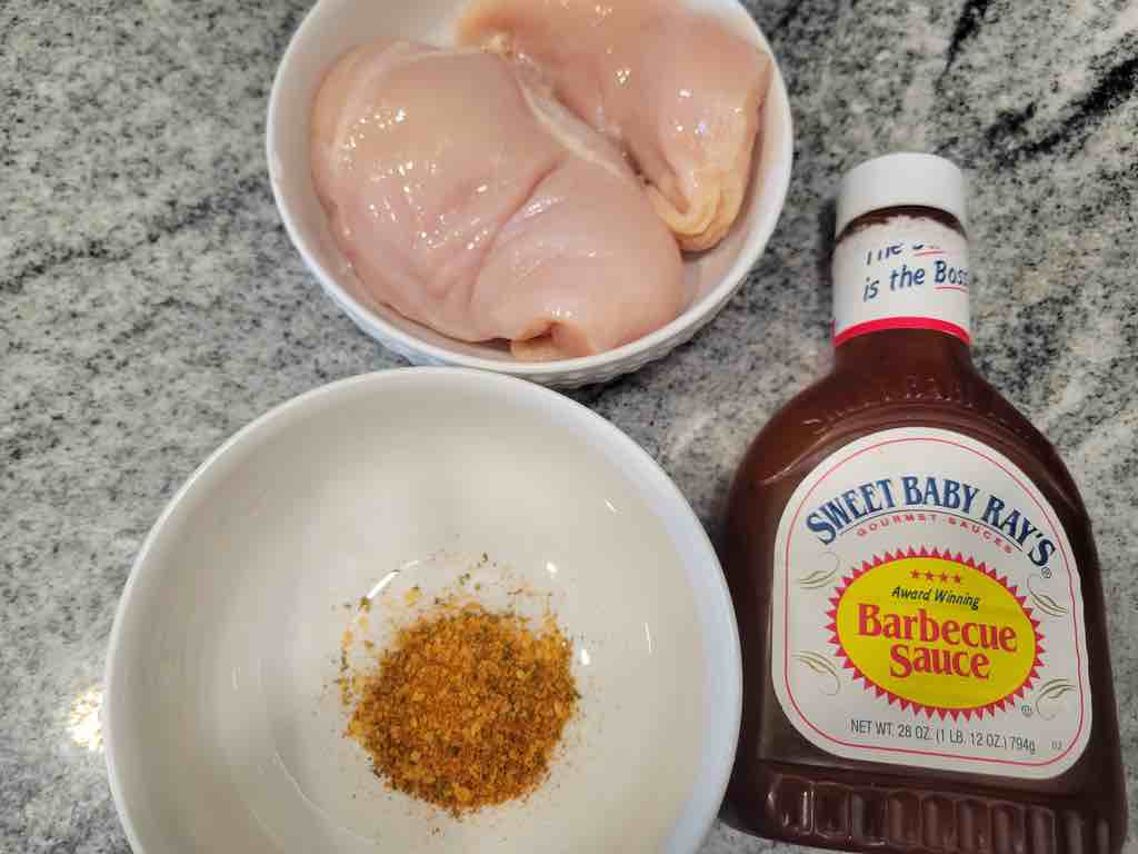 The ingredients needed for this recipe are chicken breasts, barbecue sauce, salt, black pepper, granulated garlic, cayenne pepper, ground paprika and ground oregano.