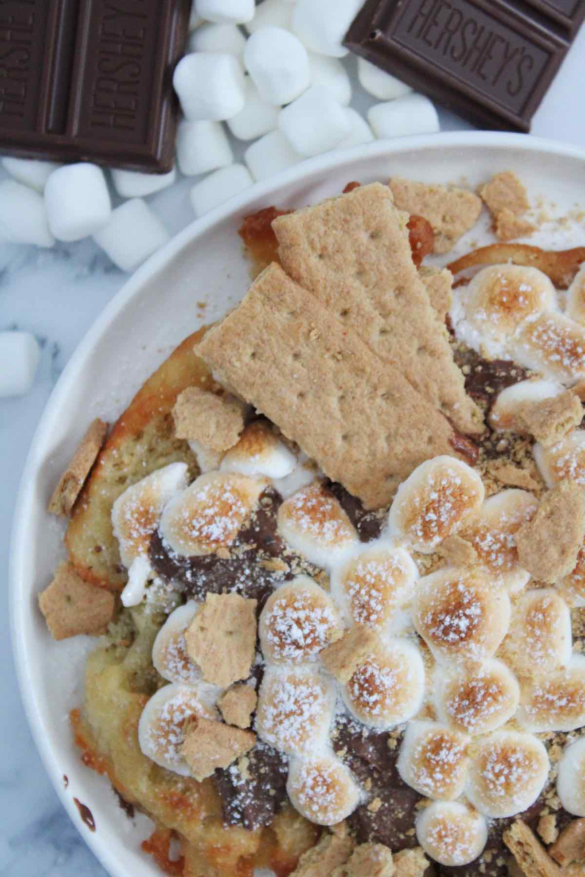 An easy recipe for s'mores funnel cake made with Bisquick baking mix.