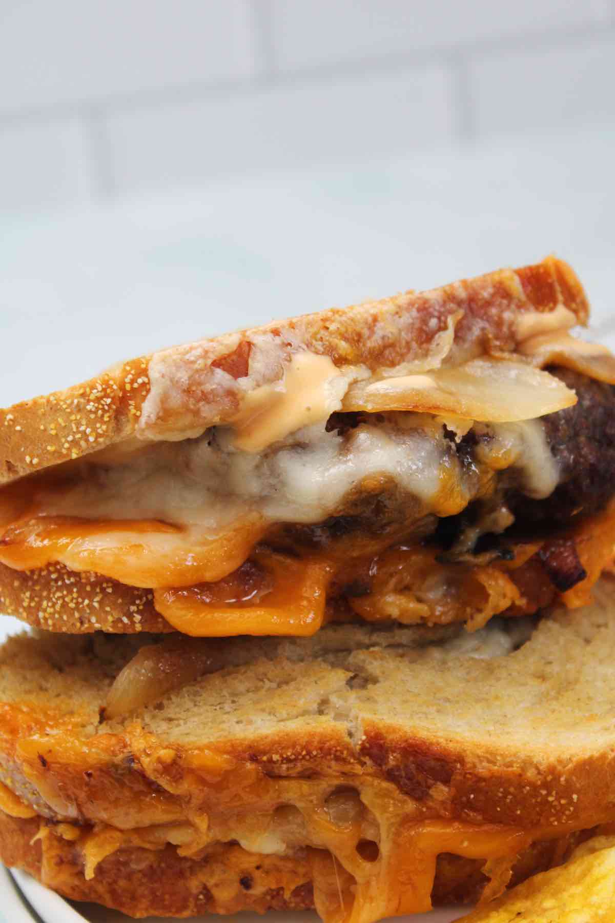 An air fried patty melt made with Swiss and cheddar cheese.