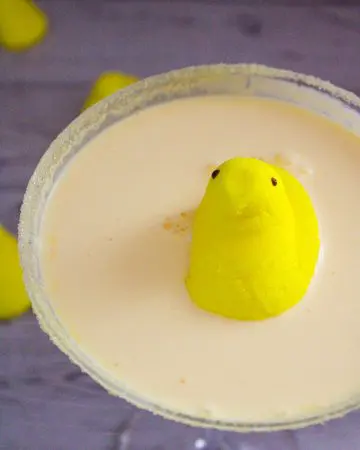 Yellow Peeptini cocktail with Easter peeps marshmallows